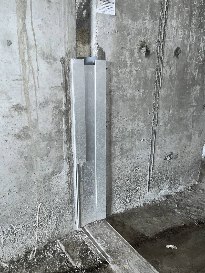 Expansion joint frame fixed into its blockout at a column, during installation