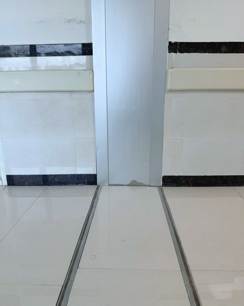 A MegAtec 360 wall joint cover meeting a SeismAtec 450 floor joint in a corridor of the Mother & Child Hospital, Guwahati Medical College