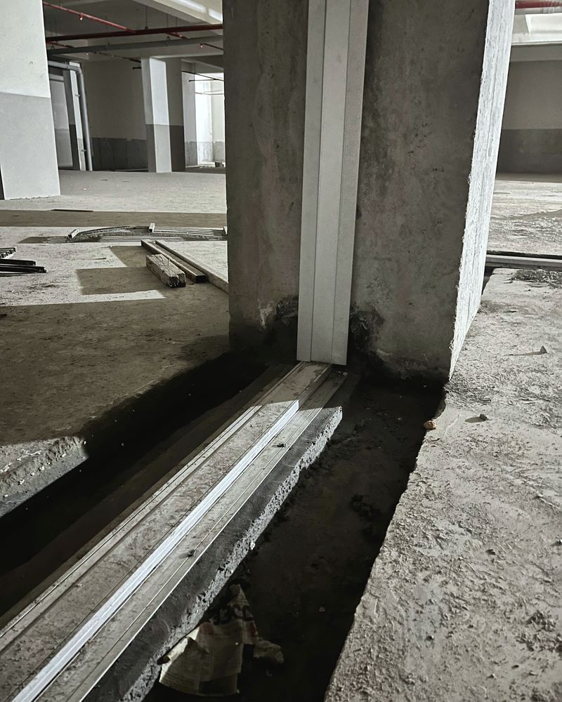 A floor expansion joint frame set in its blockout at a column during installation at Sumadhura Sarang, Bengaluru